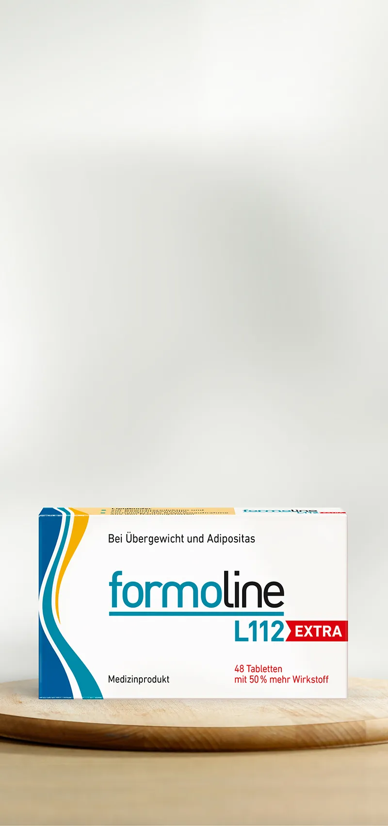 Packung formoline L112 EXTRA auf hellem Holzuntergrund.