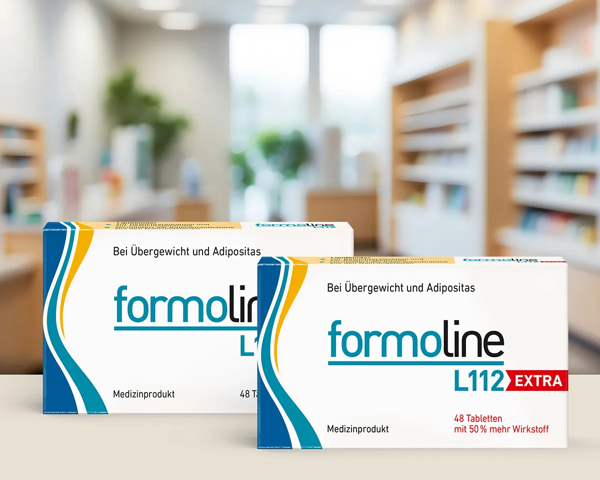 formoline L112 und L112 EXTRA Packungen vor Apothekenregalen.